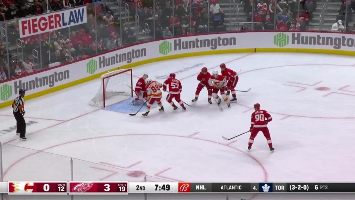 Andrew Mangiapane scores a goal against the Detroit Red Wings